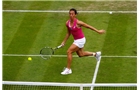 BIRMINGHAM, ENGLAND - JUNE 11: Francesca Schiavone of Italy in action against Sloane Stephens of the USA during day three of the Aegon Classic at the Edgbaston Priory Club on June 11, 2014 in Birmingham, England. (Photo by Paul Thomas/Getty Images)